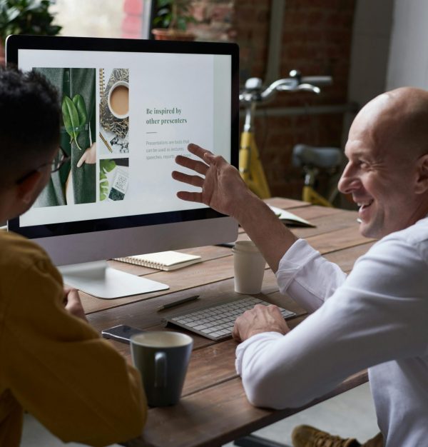 HB Automation Solutions Ltd team reviewing a strategic automation blueprint on a laptop in a UK office setting.